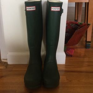 Dark green tall hunter boots